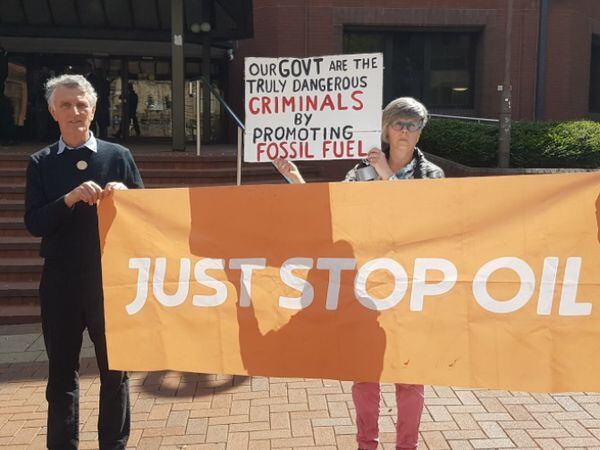 Barry Mitchell and Kate Griffith protesting outside Birmingham Crown Court