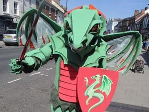 A dragon stalking Newport high street ahead of its battle with St George