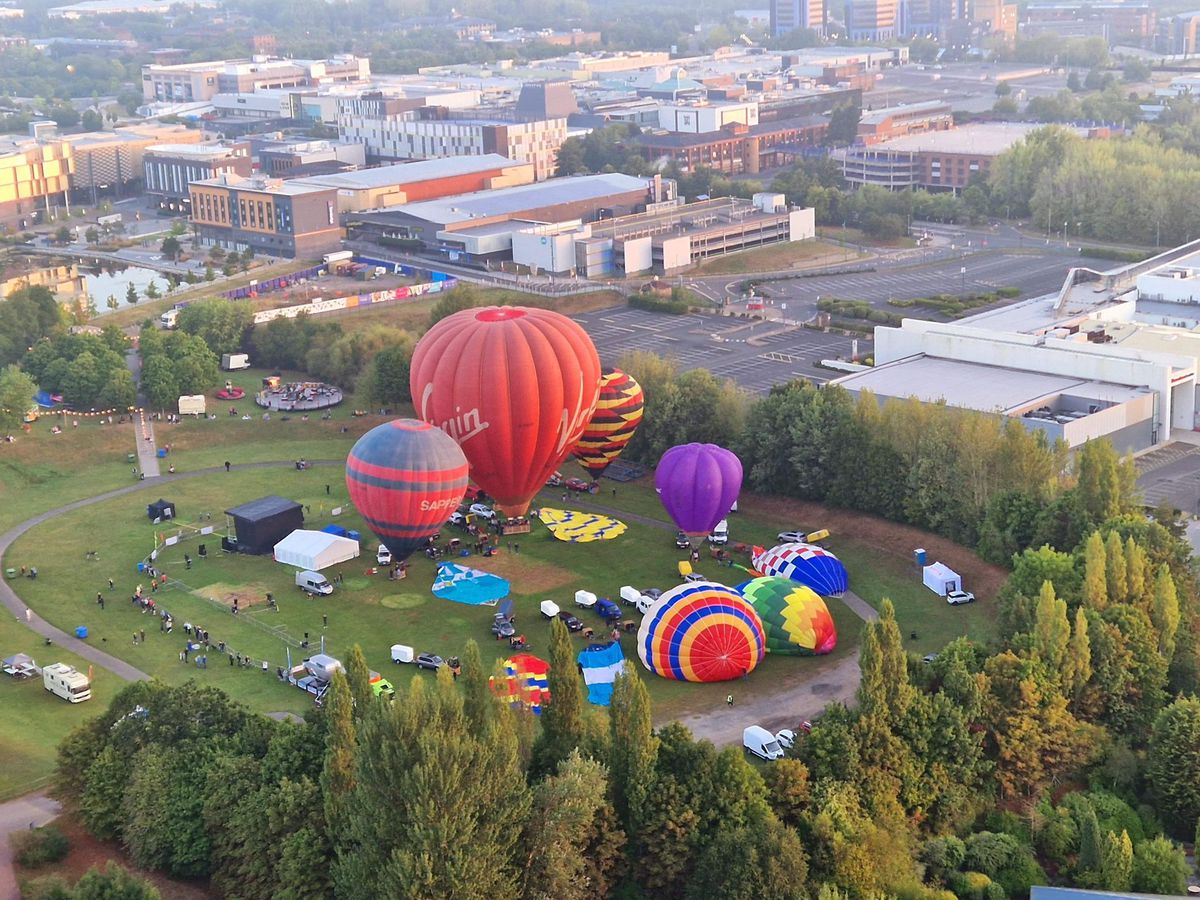 A colorful display of hot air balloons filled the sky over Telford Park