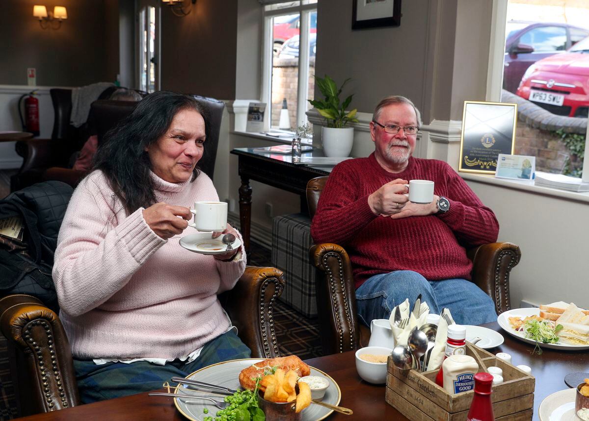 Jennifer Alexandra and Alan Cambridge enjoy their lunch at the Valley Hotel near Ironbridge after being evacuated because of flooding from their homes in the nearby village of Jackfield. Credit: Steve Parsons/PA Wire