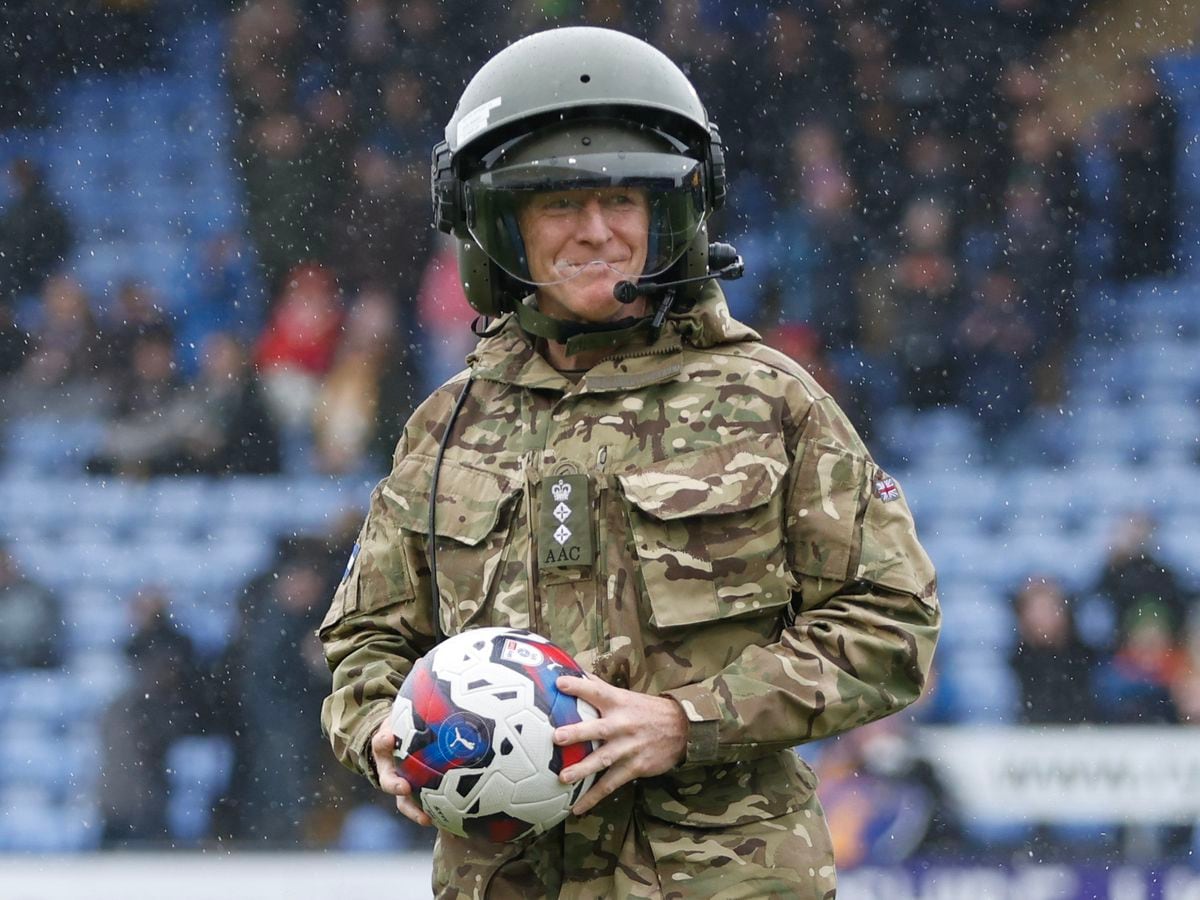 British Army officer and astronaut, Colonel Tim Peake, lands at the home stadium of Shrewsbury Town in a helicopter to deliver the matchball to celebrate the club's military matchday