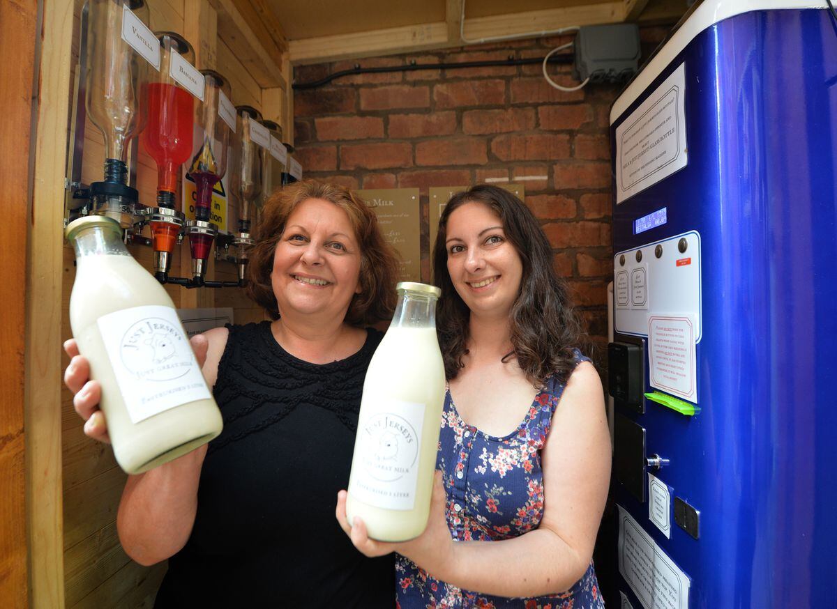 Marina Rae and daughter Lauren Silvey at the milk vending machine in Teme Street, Tenbury Wells