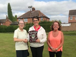 Just champion - Pauline Wilson receives the trophy from organiser Carol Faulkner watched by (right) runner-up Wendy Jones