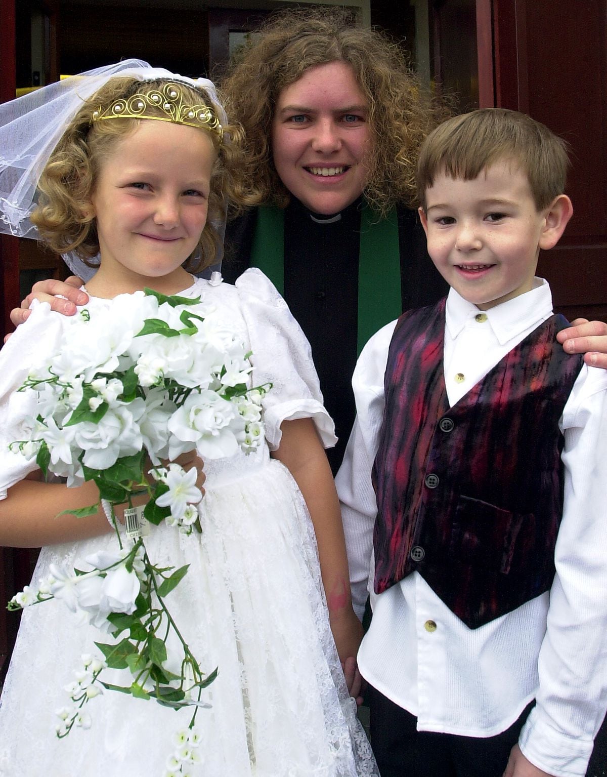 The Rev Susan McIvor with Luke Eggerton and Alice Ball, both aged six, of Ketley Infants School at a mock wedding at Ketley Methodist Church in 2000.
