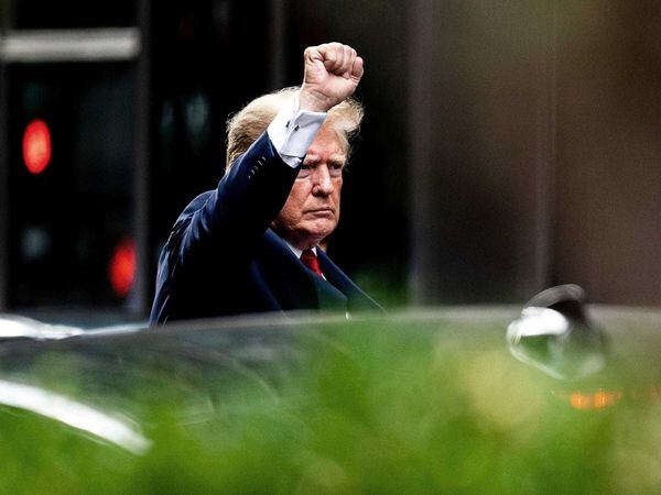 Former US president Donald Trump gestures as he departs Trump Tower on Wednesday August 10 2022 in New York