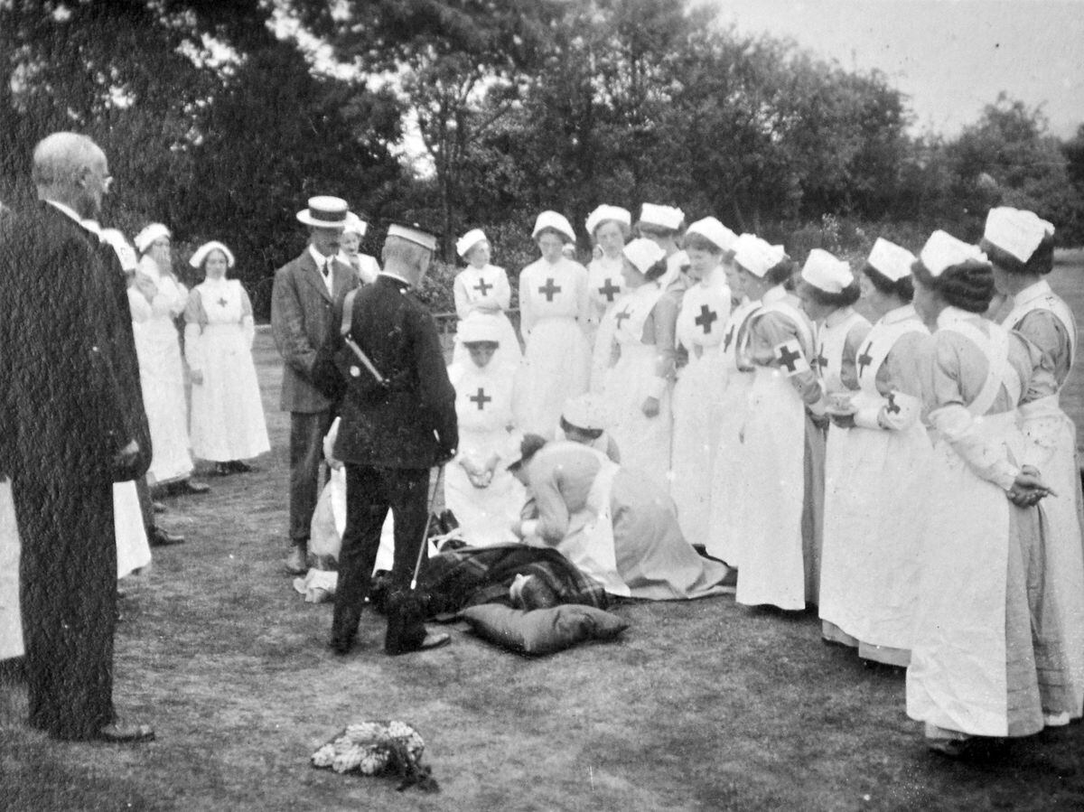Don't worry, it's a demonstration for nurses. At least we think it's a demonstration. The location is, we assume, Shifnal or Shifnal area as the photographer is Thurtle of Shifnal, and we'll guess at a date of around 1910. This is a postcard from the collection of Ray Farlow of Bridgnorth.