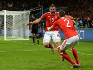 Wales' Sam Vokes (left) celebrates scoring his side's thrid goal of the game during the UEFA Euro 2016, quarter final match at the Stade Pierre Mauroy, Lille. PRESS ASSOCIATION Photo. Picture date: Friday July 1 2016. See PA story SOCCER Wales. Photo credit should read: Joe Giddens/PA Wire. RESTRICTIONS: Use subject to restrictions. Editorial use only. Book and magazine sales permitted providing not solely devoted to any one team/player/match. No commercial use. Call +44 (0)1158 447447 for further information.. 