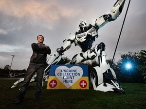 Artist Luke Kite with his robot sculpture helping with the appeal at the British Ironwork Centre