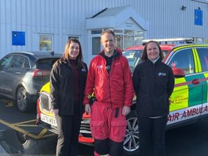 Chamber director Rachel Owen and deputy chief executive Ruth Ross with Midlands Air Ambulance critical care paramedic Stephen Mitchell