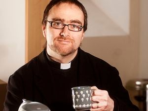 Father Hywel, who is leaving after 10 years, raises a cuppa to the future