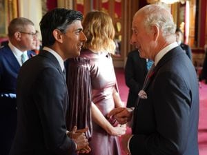 The King speaks with Rishi Sunak, during a reception at Buckingham Palace ahead of the Cop27 summit