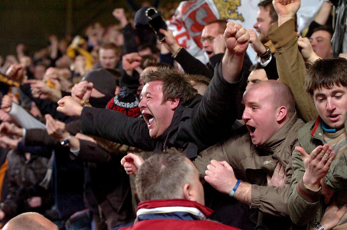 Wolves fans show their delight after Karl Henry's winner goes in.