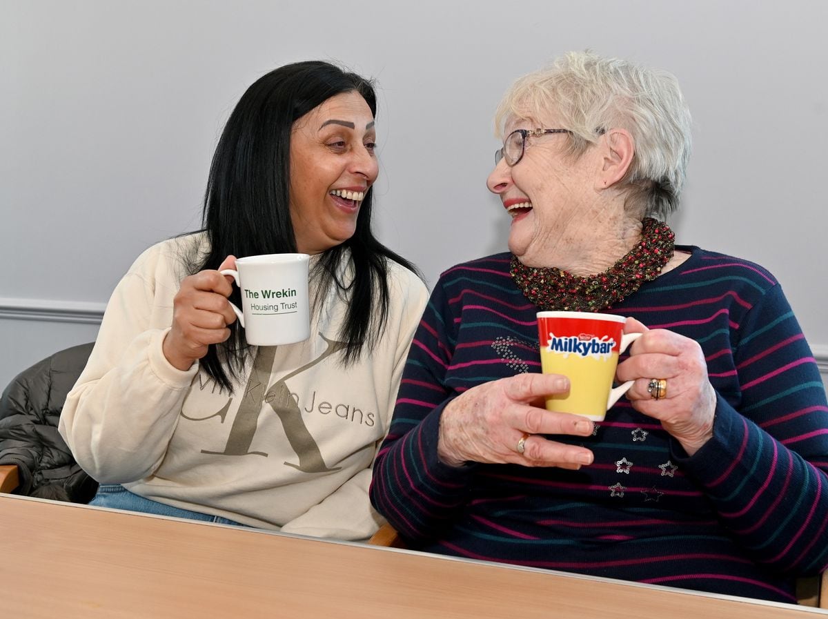 LAST COPYRIGHT MNA MEDIA TIM THURSFIELD 16/01/23.The Meet and Eat group at The Parish Centre, Grove Street, St George's, Telford, where people can meet up and stay warm..Pictured enjoying a cuppa are Herjit Kaur and Brenda Yarnold.