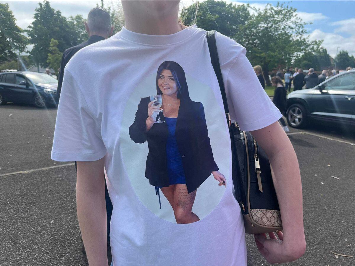 A mourner at the funeral of Rebecca Brownewearing a t shirt bearing her picture. Ms Browne died after being hit by a Garda car.