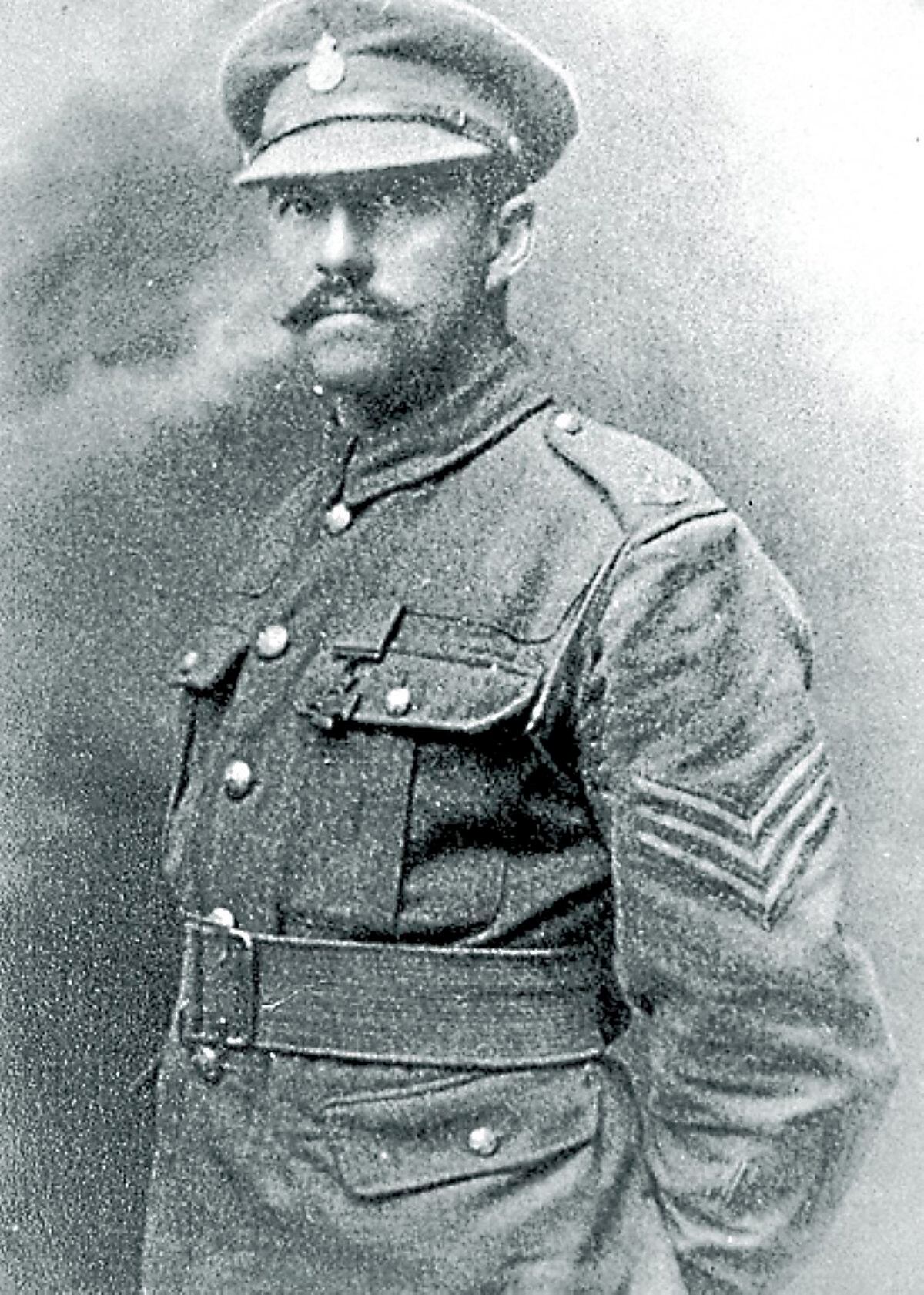 Sergeant Harold Whitfield with his Victoria Cross and proudly wearing the Shropshire Yeomanry cap badge.