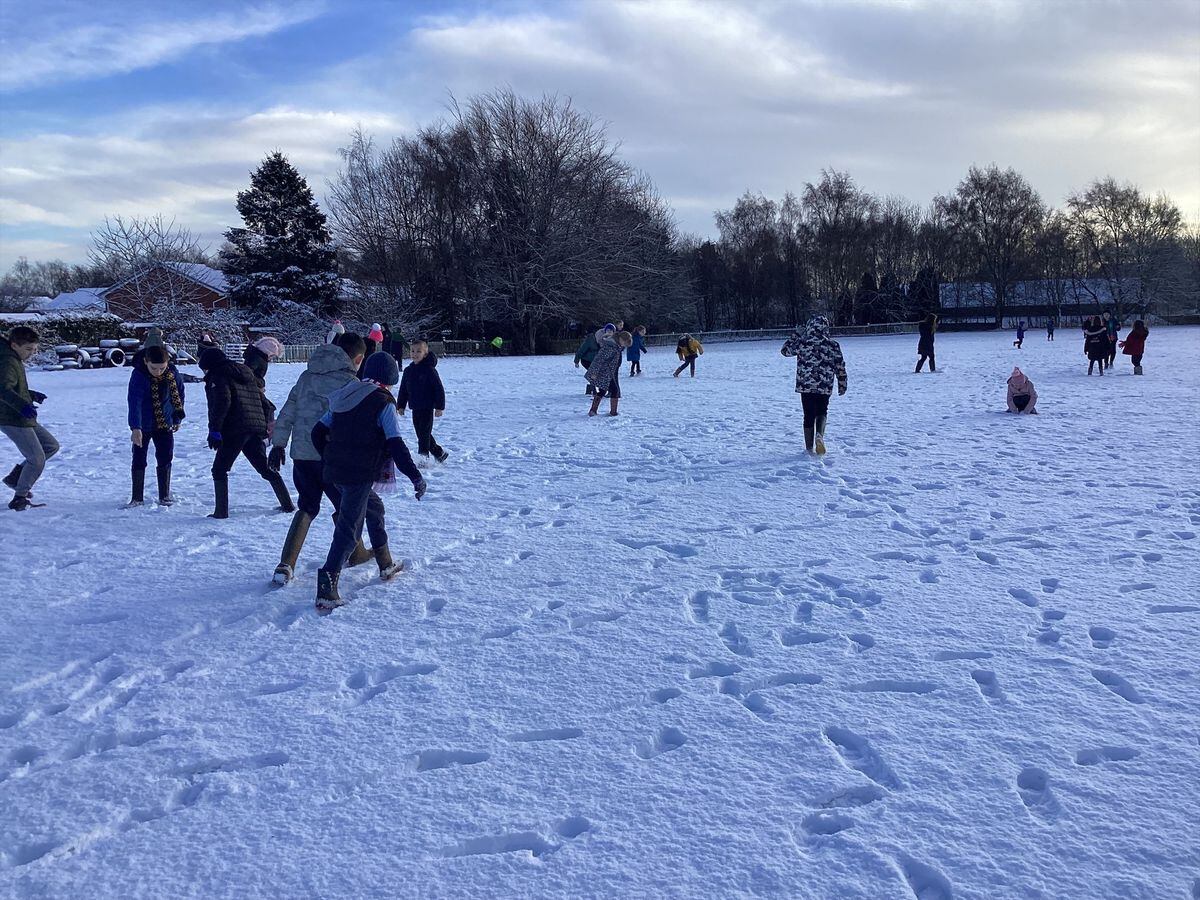 Children from Whitchurch Junior School wrapped up and enjoyed some fun in the snow. Photo: Whitchurch Junior School. 