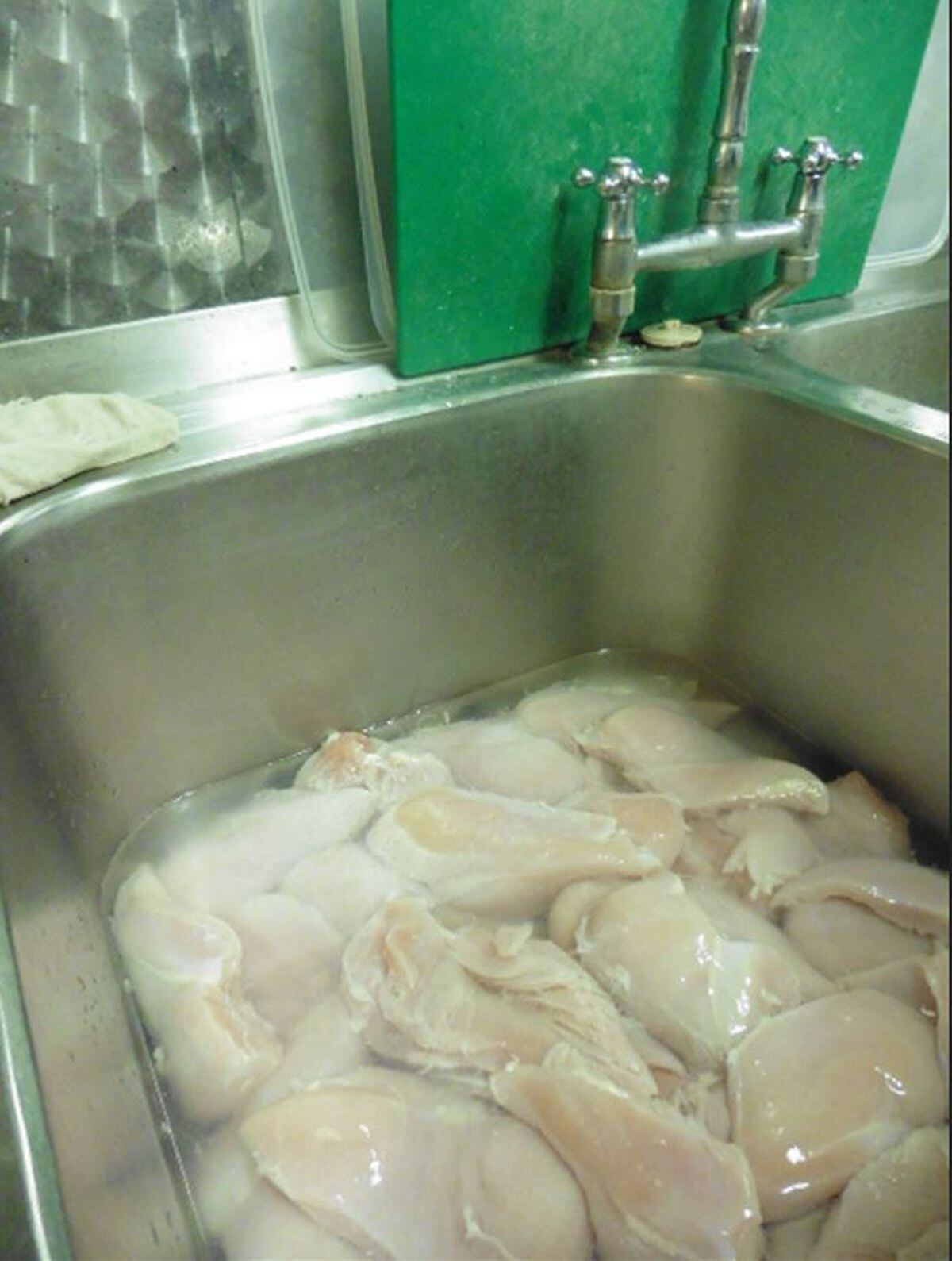 Raw chicken in the sink at Momma's Pizza. Photo: Telford & Wrekin Council