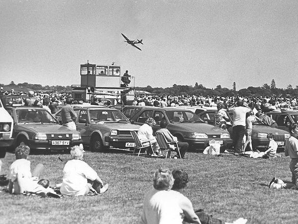 A Spitfire flies low near the crowd at the Cosford air show in June 1988