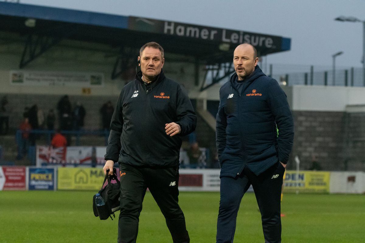 Telford Physio Adam Paget and AFC Telford Manager Paul Carden walking in at half time.