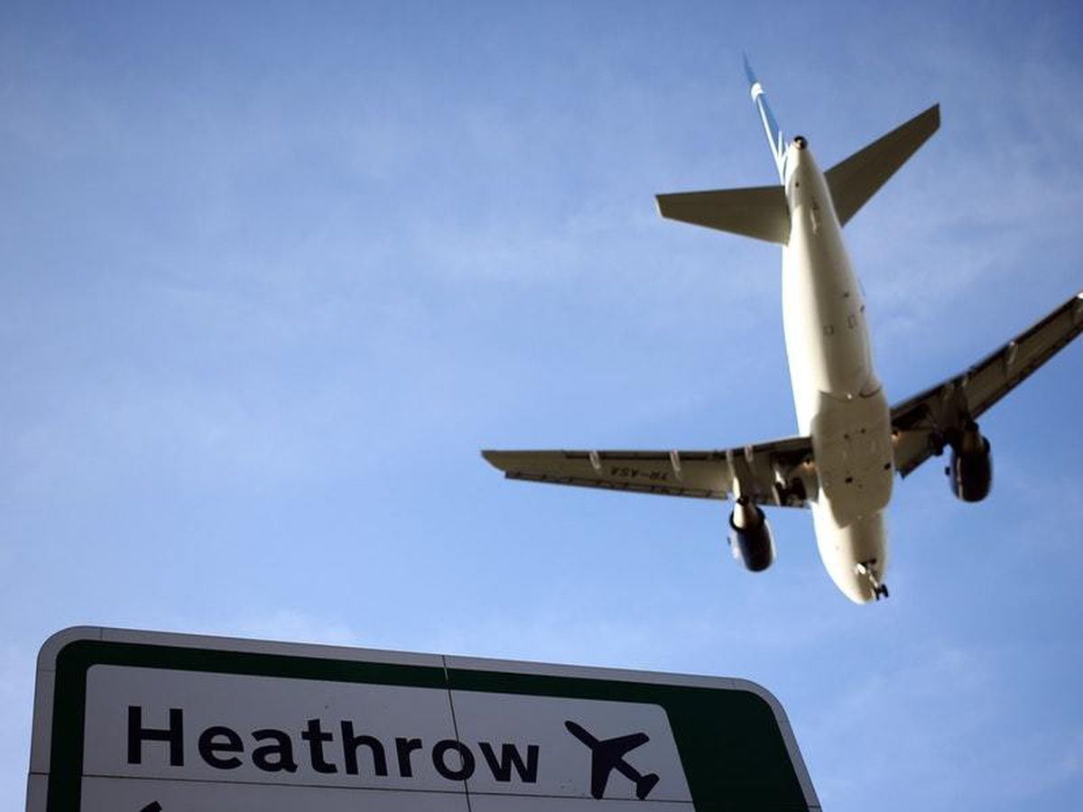 A plane lands on the southern runway at Heathrow Airport