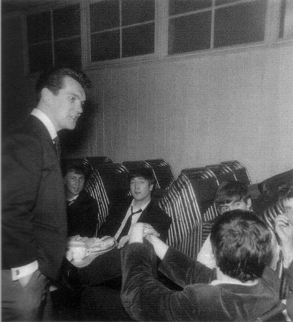 Jim Burgess, left, of Andre and the Electrons, chats with The Beatles.