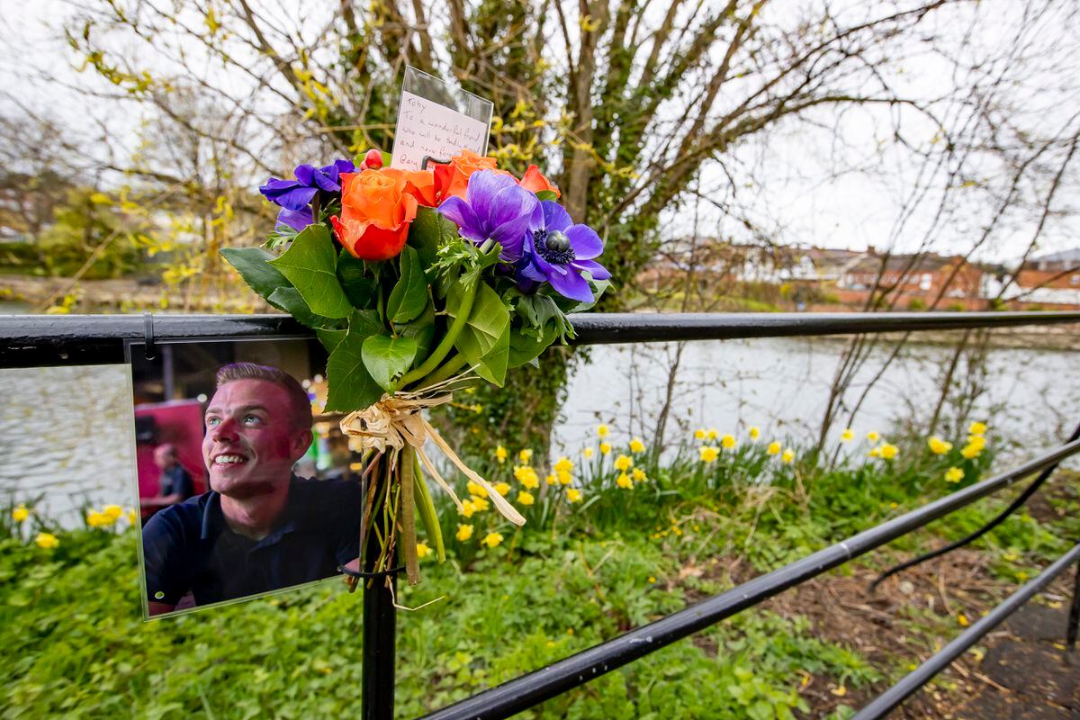Flowers were left on a section of the River Severn with a fence near the scene where Toby Jones was pulled from the water