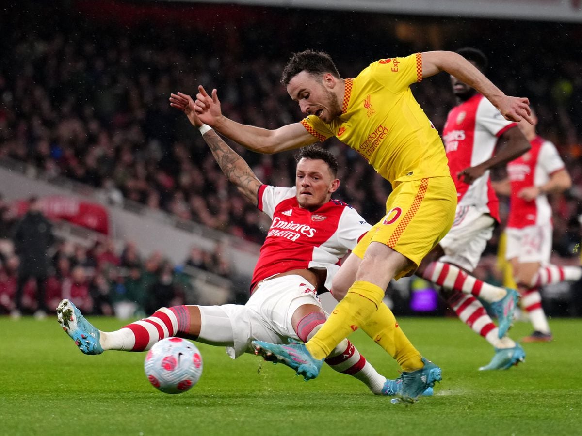 Liverpool's Diogo Jota scores their side's first goal of the game during the Premier League match at the Emirates Stadium, London. Picture date: Wednesday March 16, 2022. PA Photo. See PA story SOCCER Arsenal. Photo credit should read: John Walton/PA Wire...RESTRICTIONS: EDITORIAL USE ONLY No use with unauthorised audio, video, data, fixture lists, club/league logos or "live" services. Online in-match use limited to 120 images, no video emulation. No use in betting, games or single club/league/player publications..