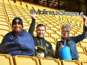 WOLVERHAMPTON PIC MNA PIC  DAVID HAMILTON PIC  EXPRESS AND STAR 27/10/21 Getting ready for the Molineux Sleepout, members of the Good Shepherd (left) Daniel Turner, and (right) Dawn Walls, with (centre) senior communicationofficer Scott Brotherton, at the Molineux Stadium, Wolverhampton..