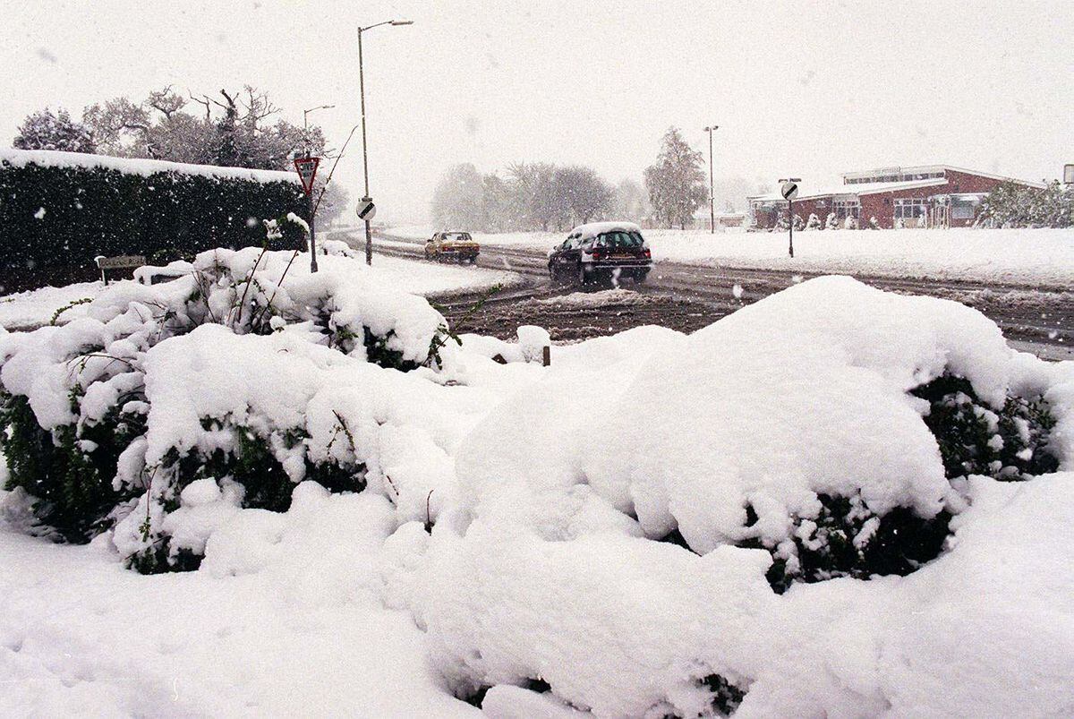 April 1998: Cars battle through the snow covered roads of Oswestry as snow and freezing temperatures bring weather havoc to major routes throughout much of Britain just days after suffering an Easter holiday washout
