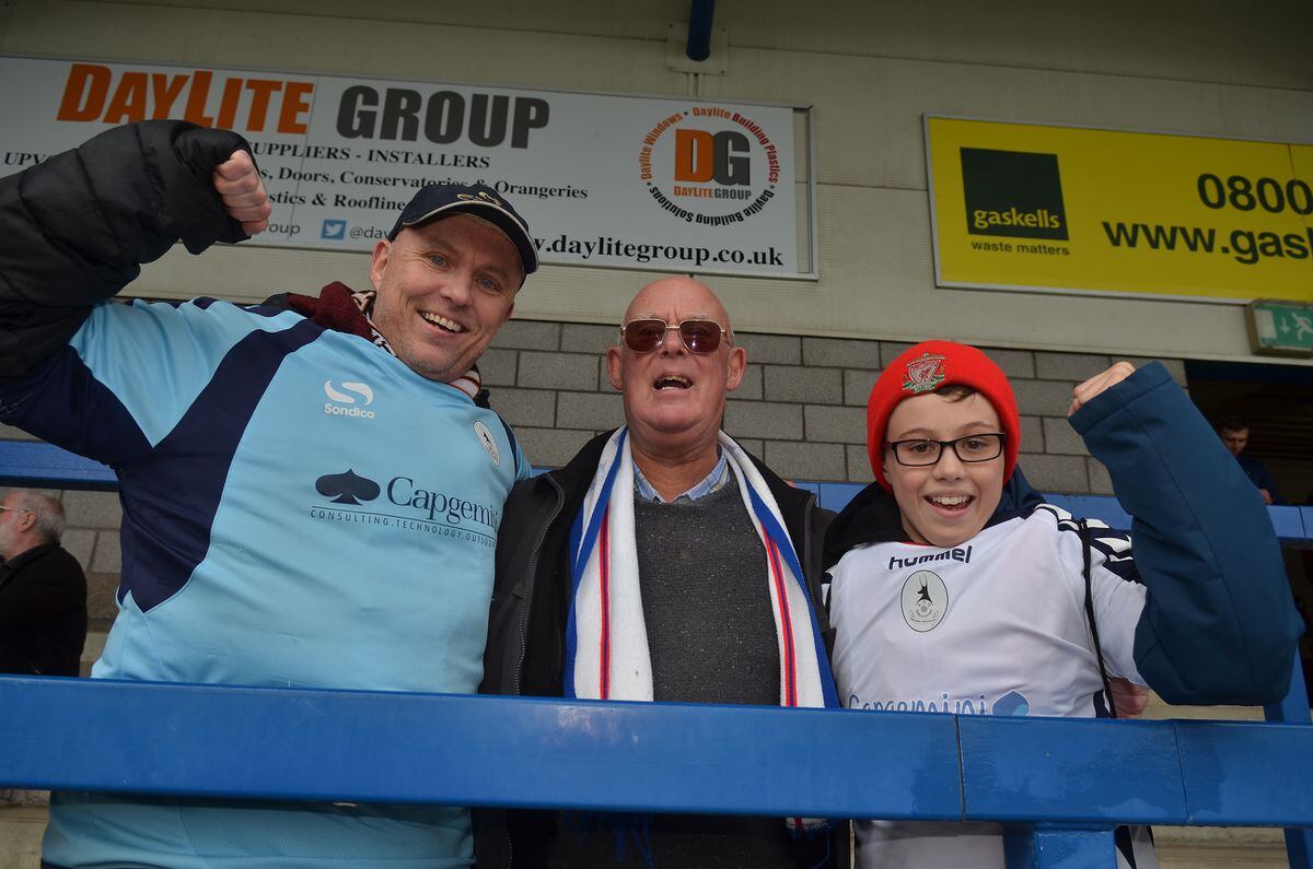 Three generations of Bucks fans, Andy, Paul and Alfie(12) Booth from Shrewsbury at the FA Trophy Semi Final fixture between AFC Telford United and Leyton Orient at the New Bucks Head.
