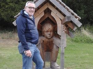 Gareth Owen in the Jebb Garden with John Merrill’s sculpture, ‘Refuge’ 