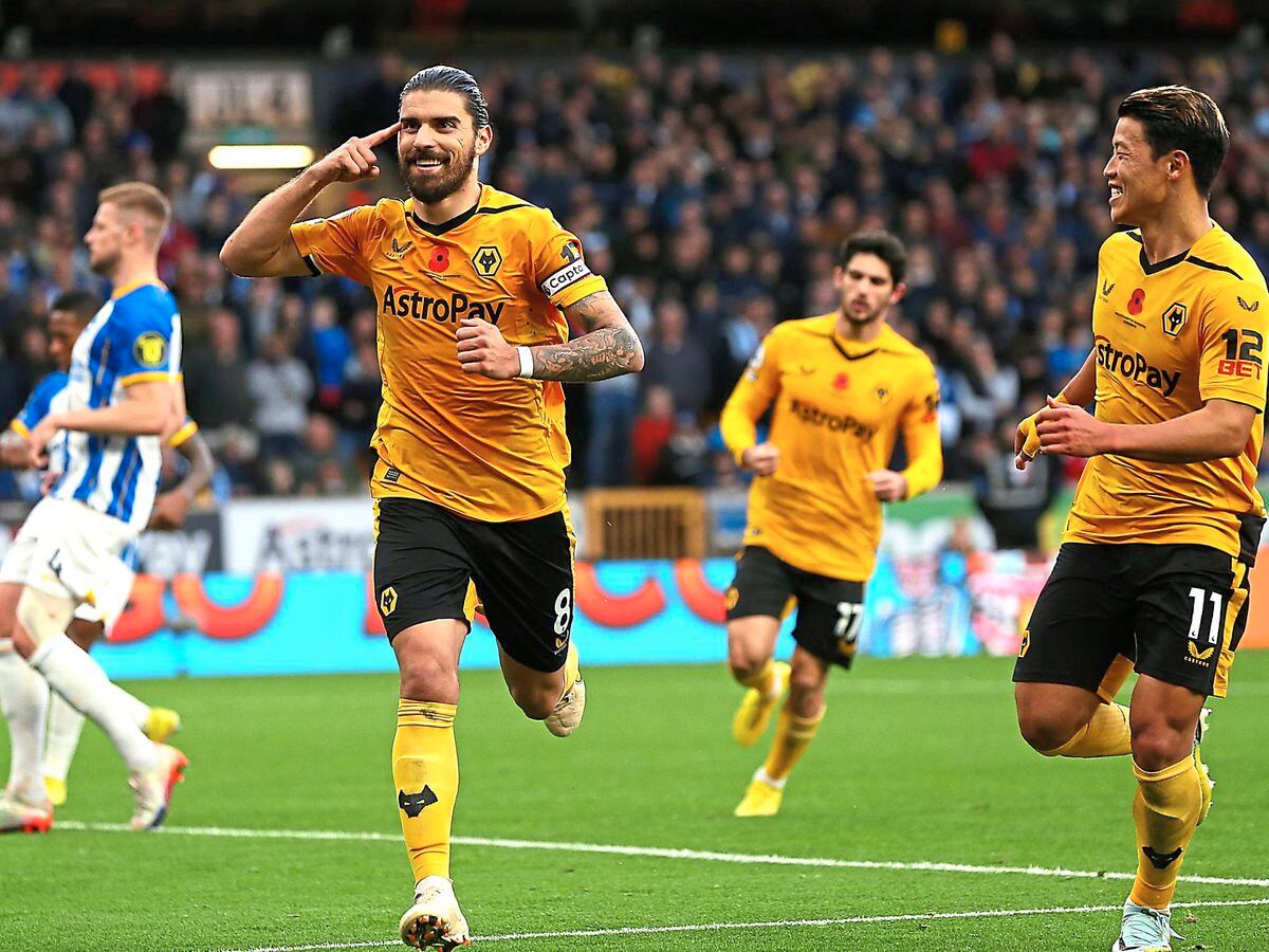 Wolverhampton Wanderers' Ruben Neves (left) celebrates scoring their side's second goal of the game from the penalty spot with team-mate Hee-Chan Hwang during the Premier League match at Molineux, Wolverhampton. Picture date: Saturday November 5, 2022. PA Photo. See PA story SOCCER Wolves. Photo credit should read: Barrington Coombs/PA Wire.RESTRICTIONS: EDITORIAL USE ONLY No use with unauthorised audio, video, data, fixture lists, club/league logos or "live" services. Online in-match use limited to 120 images, no video emulation. No use in betting, games or single club/league/player publications.