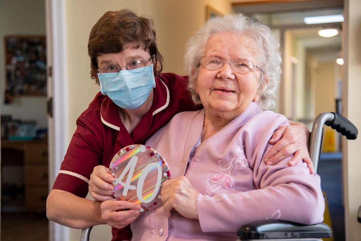 Sue Morris, celebrating 40 years at Stone House, with resident Doreen Rogers.