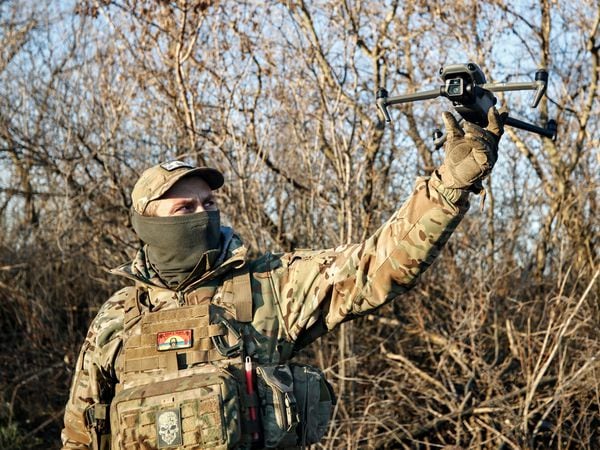 A Ukrainian serviceman flies a drone during an operation against Russian positions at an undisclosed location in the Donetsk region