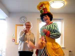 Jacqui Crewe and Festival Drayton Centre's panto dame at the bra bank in the centre