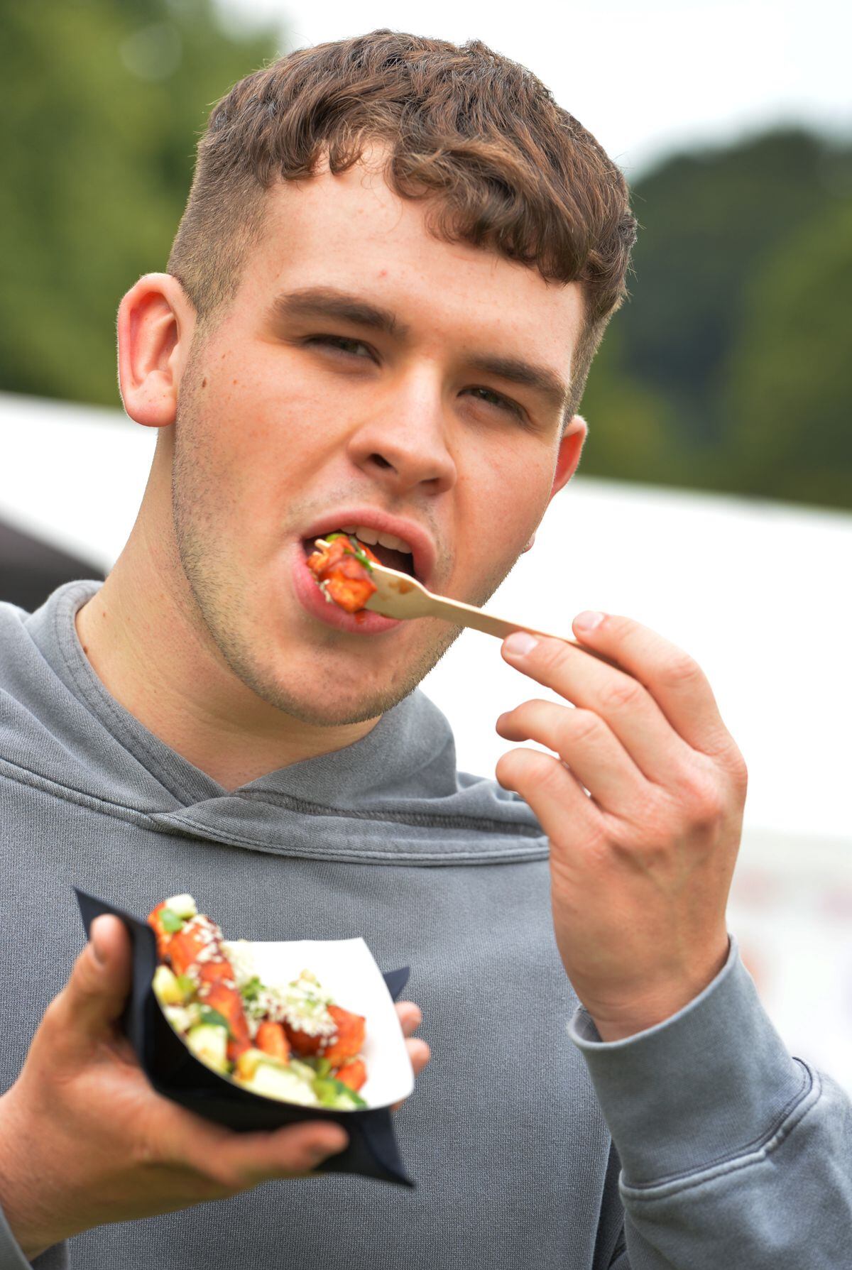 Enjoying food from Halloumination, Sam Richards, of Shrewsbury, during Shrewsbury Food Festival, at The Quarry