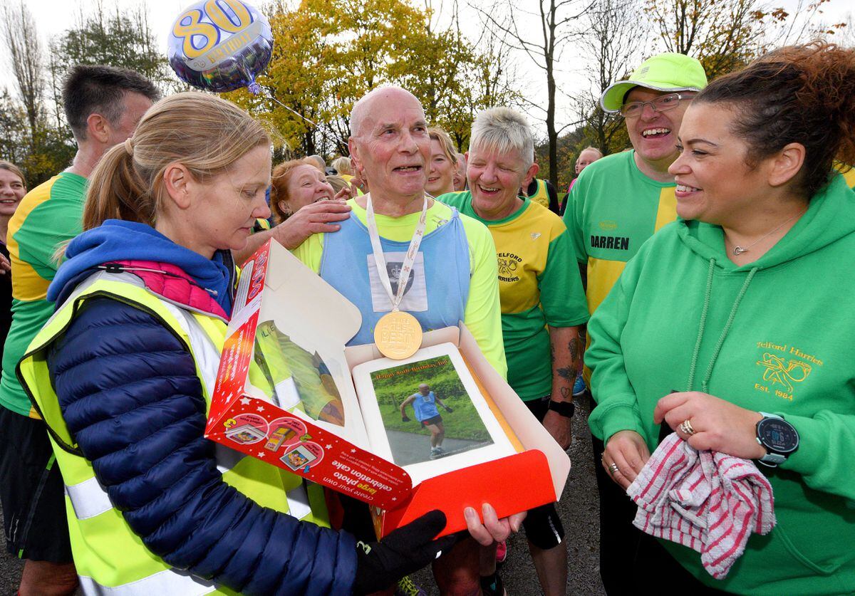 Jim Hussey celebrates his 80th birthday during the Telford Park run