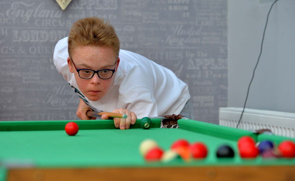 Christian Peacock, 15, enjoys playing snooker