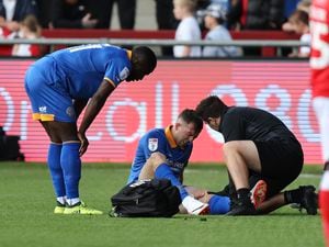 Jordan Shipley of Shrewsbury Town receives treatment for an injury (AMA)
