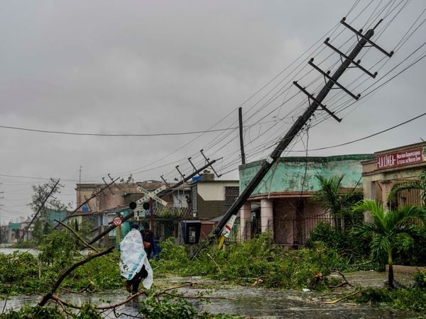 Fallen utility poles and fallen branches line a street after Hurricane Ian hit Pinar del Rio, Cuba