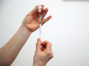 A vial of Covid-19 vaccine. (Nick Potts/PA)