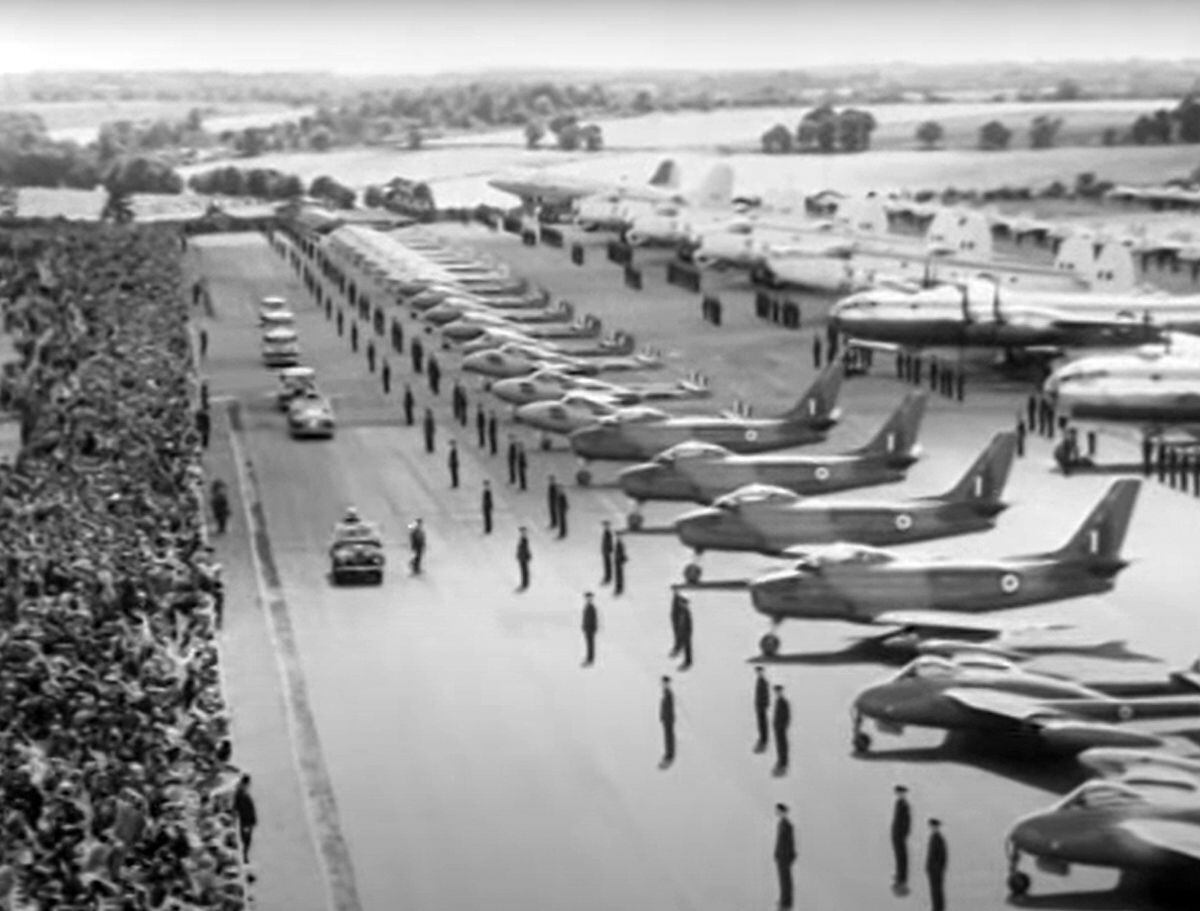 The royal car gets a close look at some of the line-up at the huge RAF review held to celebrate the Queen's Coronation in 1953.