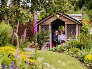Joan and Chris Birkett in their garden in Temeside, Ludlow