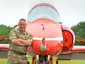 Getting ready for the RAF Cosford Air Show, at RAF Cosford, Squadron Leader Chris Wilson, with one of the Red Arrows aircraft..