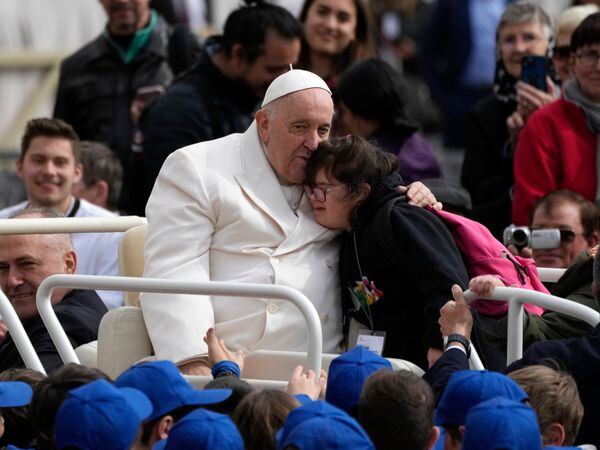 Pope Francis hugs child
