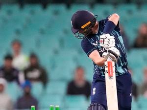 England's Chris Woakes is bowled during the one day cricket international between England and Australia at the Sydney Cricket Ground, in Sydney, Australia, Saturday, Nov. 19, 2022. (AP Photo/Mark Baker).