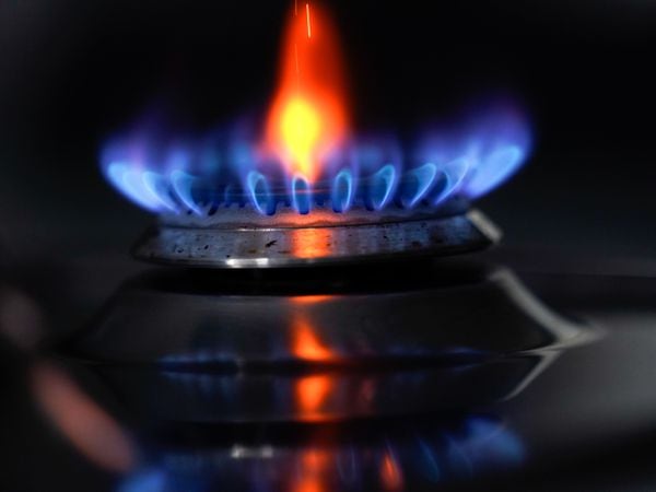 A gas hob burning on a stove in a kitchen (Andrew Matthews/PA)