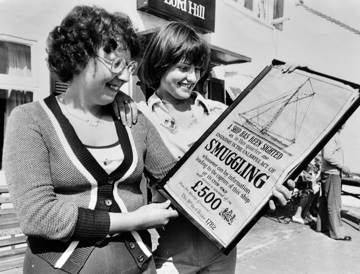 Deborah Lloyd, left, and Debbie Jarvis, of Broseley, view a unusual poster on display at the Lord Hill Inn in the town in August 1977, which offers a reward of £500 for information leading to the capture of an 18th century smuggling ship. The amount is tempting but you'd need amazing eyesight to see the ship from Broseley.