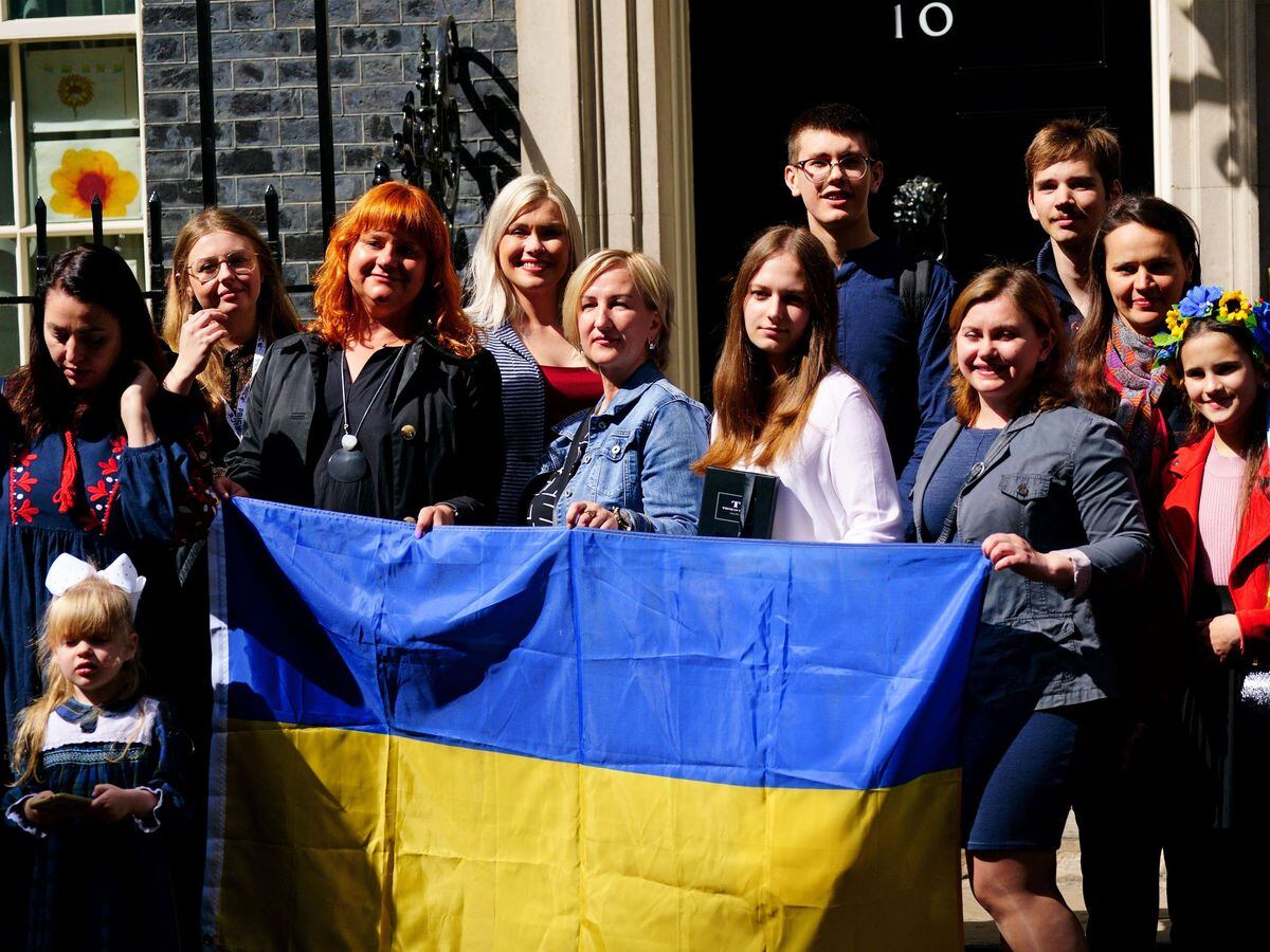 A number of Ukrainian families stand on the doorstep of 10 Downing Street after meeting Prime Minister Boris Johnson