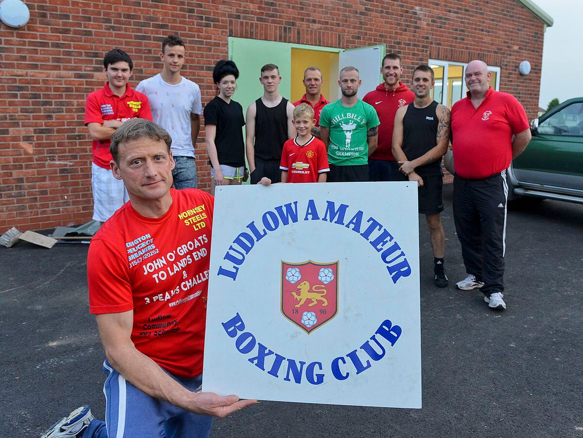 Jeremy Clowes with boxers and staff at the new club building